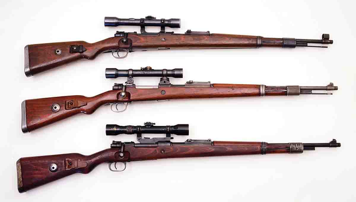 These sniper rifles are more or less original and include (top to bottom): a K98k with a Kahles 4x scope in short side rail mounts, a K98k with a Zeiss 4x scope in low turret mounts and a K98k with a Hensoldt 4x scope in long side rail mounts.